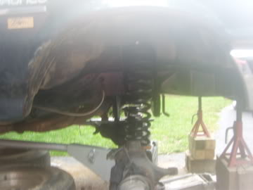1989 Ford Bronco - Close-up of the vehicle's undercarriage, focusing on the suspension system.