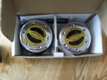 1989 Ford Bronco - Two new Warn manual locking hubs are shown inside their original packaging with instructions.