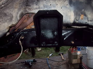 1989 Ford Bronco - Close-up view of painted frame and suspension parts, with SuperMotors logo visible.