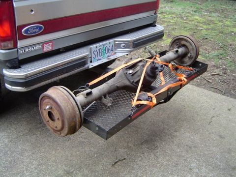 1988 Ford Bronco - A Ford pickup truck is seen from the rear, with a trailer hitch carrying a rear axle assembly.