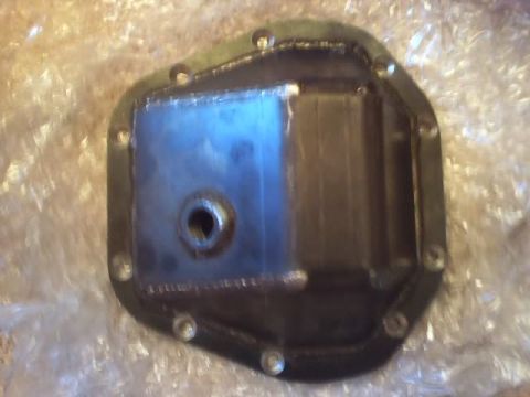 1989 Ford Bronco - A close-up view of a differential cover, likely for a vehicle's rear axle.