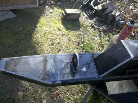 1989 Ford Bronco - Custom metal bumper with a tow hook, likely for an off-road vehicle, shown outdoors.