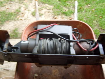 1989 Ford Bronco - Winch assembly is placed inside a wheelbarrow, with SuperMotors.net branding visible.