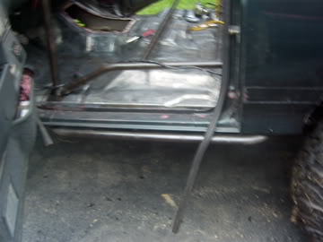 1989 Ford Bronco - Custom roll cage installed inside the passenger compartment of a vehicle.