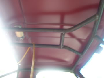 1989 Ford Bronco - Metal roll cage structure visible inside a vehicle's cabin.