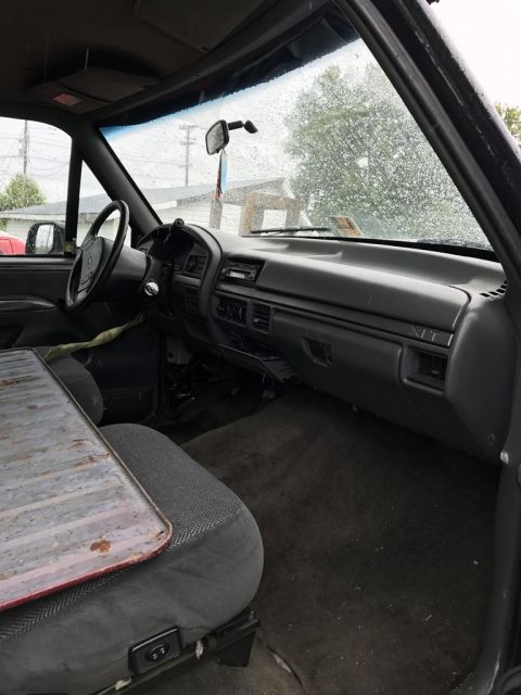 1992 Ford Bronco - Interior view of a 1992 Ford Bronco, including the dashboard and front seating.