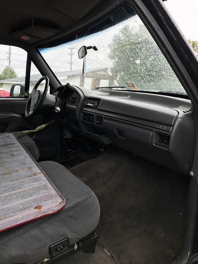 1992 Ford Bronco interior showing dashboard, steering wheel, and bench seat