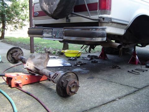 1988 Ford Bronco - Rear axle removed from a 1988 Ford Bronco, with the vehicle supported by jack stands.
