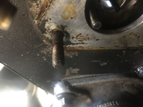 1985 Ford F-350 - A close-up view shows a bolt threaded into a metal component, with visible rust and grime. The Supermotors.net logo is present in the lower…