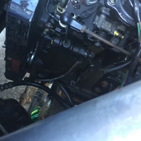 1985 Ford F-350 - Detail of an engine's fuel injection system, showing various lines and components.