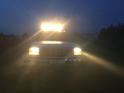 1993 Ford Bronco - This truck has a light bar mounted on the roof and auxiliary lights on the front bumper.