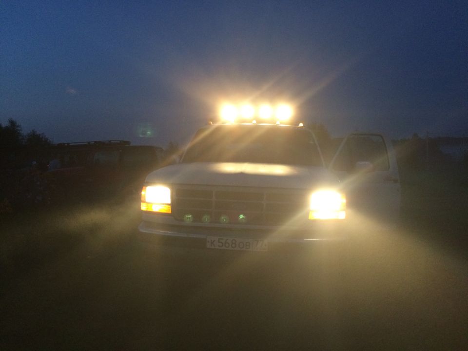 White 1993 Ford Bronco with roof lights and fog lights