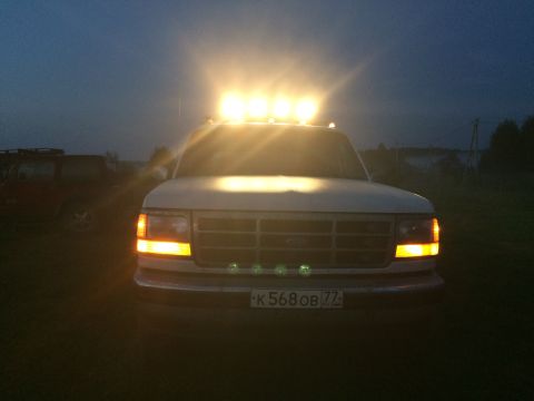 1993 Ford Bronco - A 1992 Ford F-Series truck is shown at dusk with its roof lights illuminated.