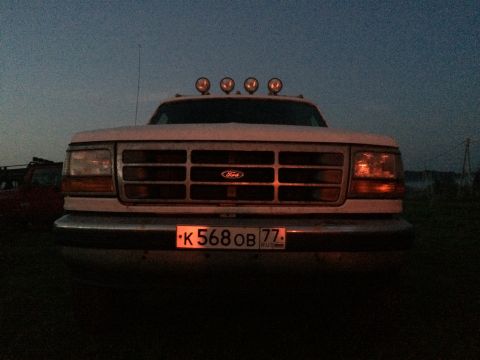 1993 Ford Bronco - This Ford F-Series truck features quad headlights and a distinctive grille, likely from the 1992-1997 model years.