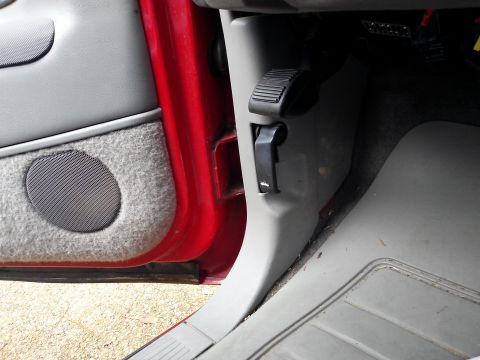 1998 Chevrolet C/K Pickup - Close-up of the interior of a 1998 Chevrolet C/K Pickup, highlighting the door panel, speaker, and dashboard trim.