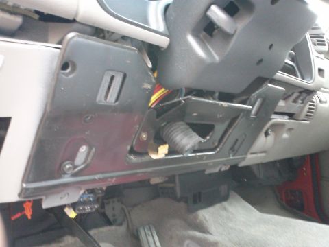 1998 Chevrolet C/K Pickup - Interior view of a 1998 Chevrolet C/K Pickup dashboard, revealing exposed wiring and ductwork.