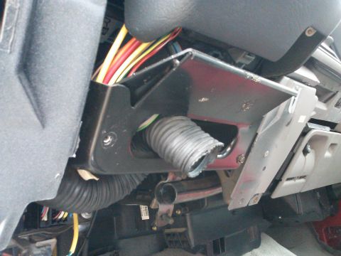 1998 Chevrolet C/K Pickup - Close-up view of the interior wiring harness and protective conduit.