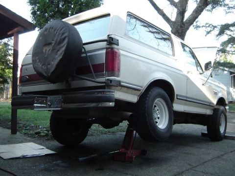 1988 Ford Bronco - This 1987 Ford Bronco is being worked on, with its rear lifted by a jack.
