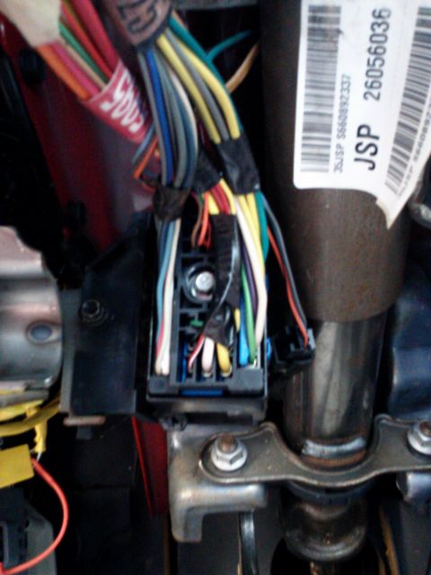 1998 Chevrolet C/K Pickup - Interior wiring harness and fuse box with numerous colored wires visible.