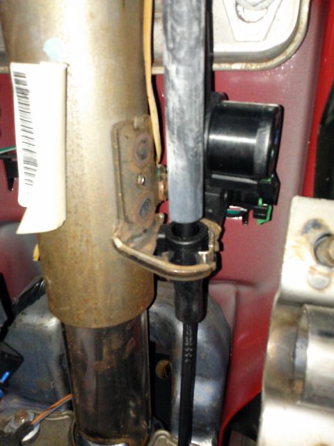 1998 Chevrolet C/K Pickup - Steering column component with attached wiring and bracketry visible.