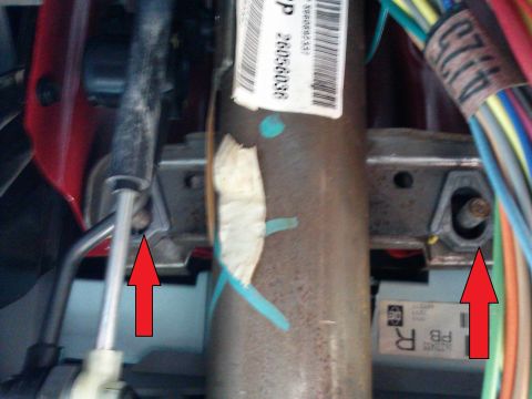 1998 Chevrolet C/K Pickup - Detail shot of the steering column assembly, showing various mechanical and electrical components.