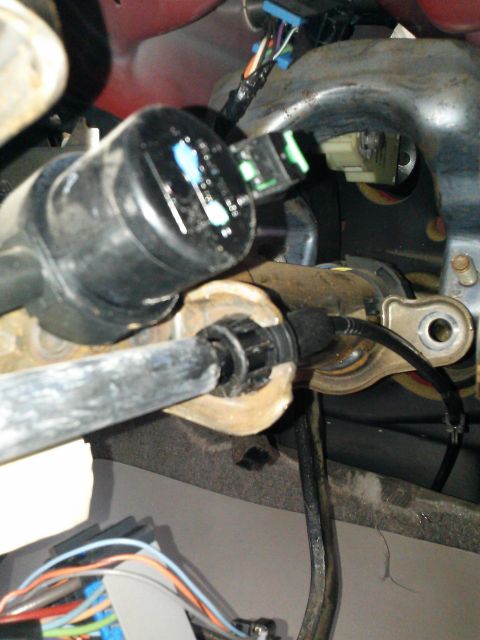 1998 Chevrolet C/K Pickup - Interior view of steering column parts and wiring harness, with no clear year identification.