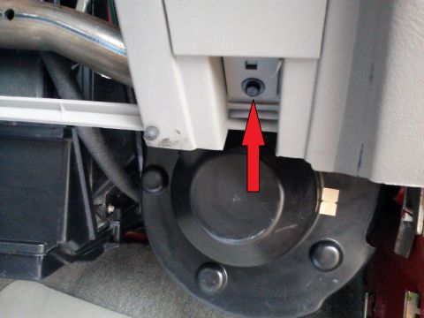 1998 Chevrolet C/K Pickup - Close-up of interior dashboard components, showing a bolt indicated by a red arrow.