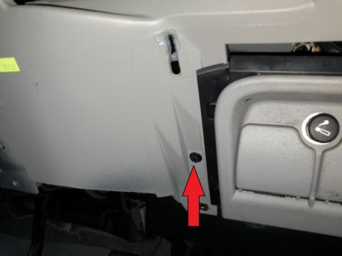 1998 Chevrolet C/K Pickup - Interior panel detail with a screw indicated by a red arrow.