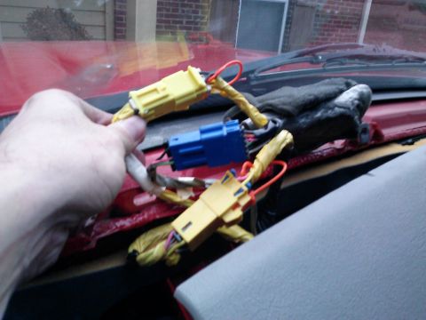 1998 Chevrolet C/K Pickup - Disconnecting wiring harness connectors for dashboard repair in a 1998 Chevrolet C/K Pickup.