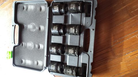 1984 Ford Bronco - Photo of a case of large black impact sockets with inch size markings.