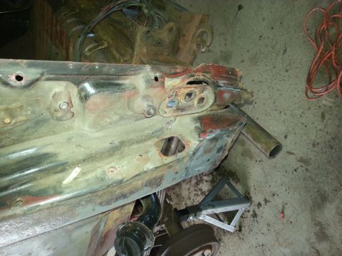 1984 Ford Bronco - Photograph of a partially stripped vehicle body panel during restoration, not a technical document.