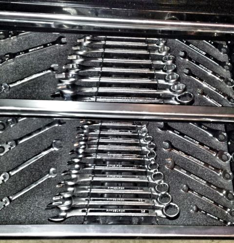 1984 Ford Bronco - Photo of combination wrenches arranged neatly in foam trays inside a tool chest drawer, not a document.