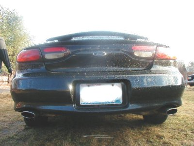 1997 Ford Taurus - Rear view of a black 1997 Ford Taurus sedan parked outdoors.
