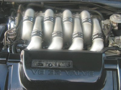 1997 Ford Taurus - Close-up of a V8 32 Valve engine intake manifold, likely from a Ford vehicle.