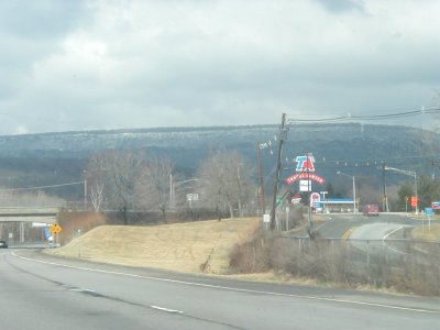 1997 Ford Taurus - TA Travel Center sign visible from the highway with a gas station in the background.