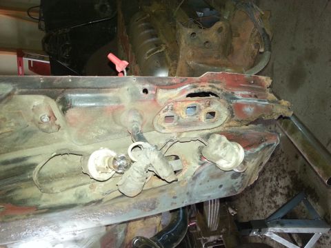 1984 Ford Bronco - Photograph of a rusty sheet-metal body panel during restoration, not a technical document.