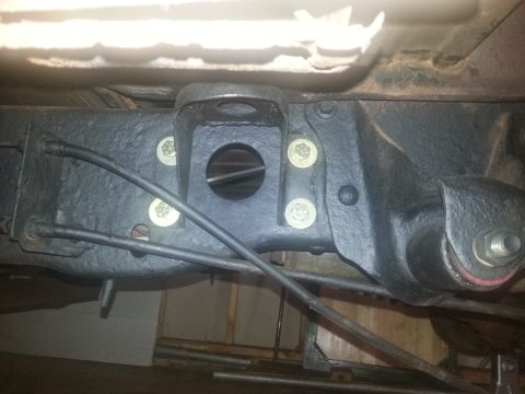 1984 Ford Bronco - This image shows a close-up view of a vehicle's rear axle suspension assembly, focusing on the mounting hardware.