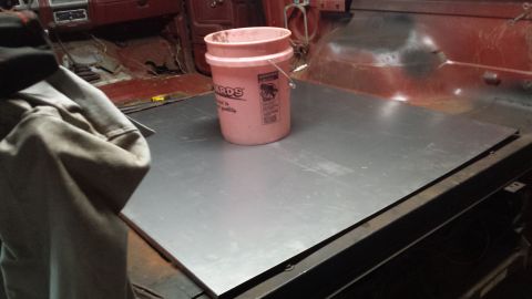 1984 Ford Bronco - Photo of a new metal panel resting in a truck during a restoration project.