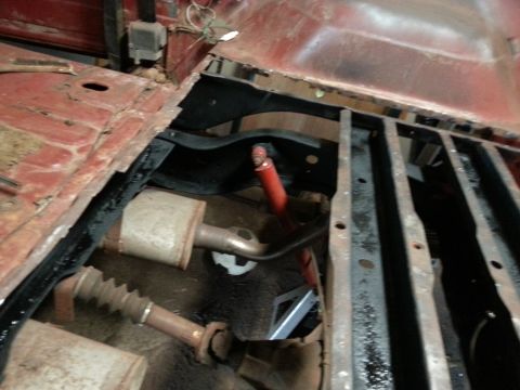 1984 Ford Bronco - Photo of a vehicle frame and suspension components viewed from above during restoration.
