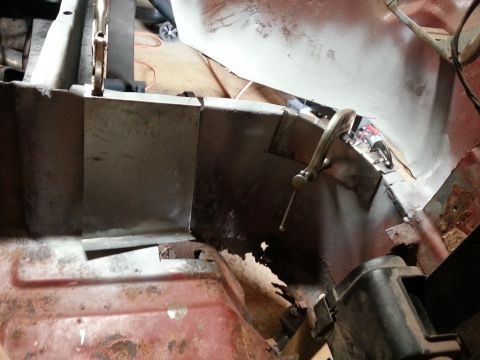 1984 Ford Bronco - Photo of fabricated patch panels tacked into a corroded floor area during restoration.