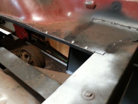 1984 Ford Bronco - Restoration photo of a fabricated sheet-metal panel installed under a truck bed, not a technical document.