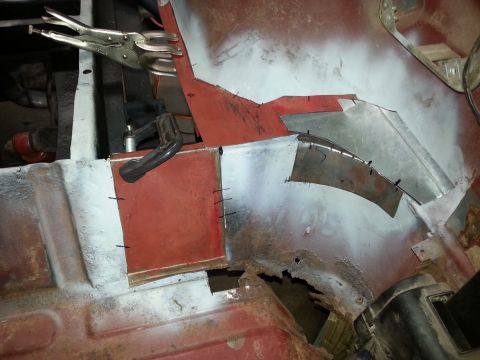 1984 Ford Bronco - Bodywork photo of tack-welded patch panels clamped during rust repair, not a technical document.