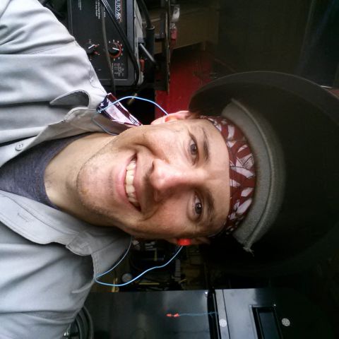1984 Ford Bronco - Personal selfie of a worker in a fabrication shop, not a technical document.