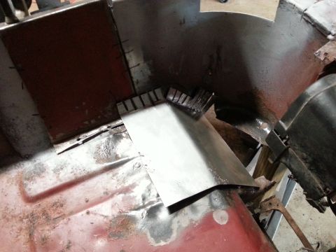 1984 Ford Bronco - Bodywork photo of a flanged metal patch fitted into a curved area, not a technical document.