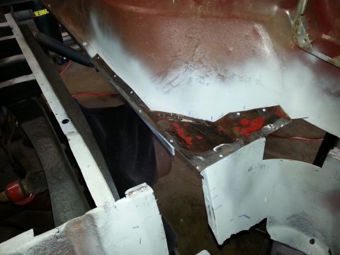 1984 Ford Bronco - Restoration photo of a clamped patch panel under a primered body, not a technical document.