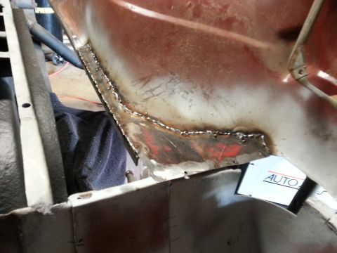 1984 Ford Bronco - Bodywork photo of a freshly welded patch seam on a body section, not a technical document.