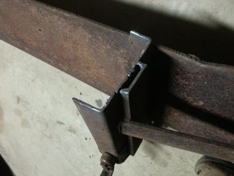 1984 Ford Bronco - Photo of a welded steel bracket and frame joint, not a technical document.
