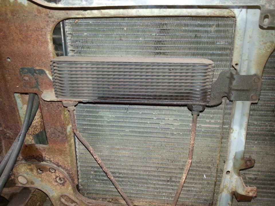 Transmission oil cooler mounted in front of a radiator on a classic truck