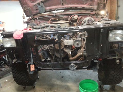 Front of a truck with engine and radiator support exposed