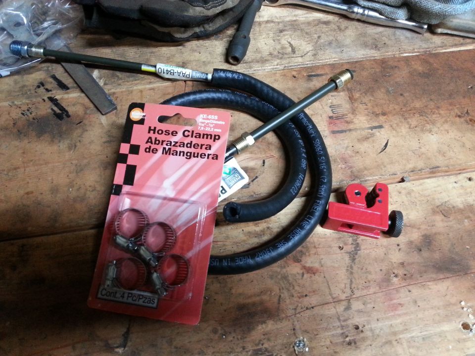 Hose, fittings and a hose-clamp package on a workbench